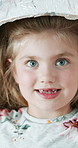Light, education and child in house with project, assignment or homework for knowledge and learning. Tech, growth and girl with science headwear for development, research or innovation in apartment.