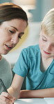 Mother, son and writing in notebook with homework, assistance and discussion for learning development. Woman, child and conversation in home with study notes, education and help for knowledge growth.