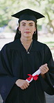 Graduation, face or woman on campus with diploma, university pride or ambition in academic achievement. Education, gown or college student with portrait, confidence or success in certificate ceremony