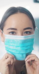 Face mask, doctor and woman in hospital, healthcare and medical procedure for protection. Person, physician and professional in clinic, cover for safety and ppe for hygiene compliance and protocol