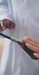 Doctor, hands and team with tablet for discussion, planning and research medical aid in hospital. People, conversation and scroll in clinic with tech, browsing or website for health insurance policy.