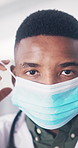 Face mask, doctor and black man in hospital, healthcare and medical procedure for safety. African person, physician and professional in clinic, cover for protection and ppe for hygiene compliance