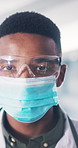 Face, doctor and black man in hospital with mask, hygiene and medical safety for protection. Portrait, protocol and surgeon in workplace with goggles, virus prevention and healthcare ppe for wellness