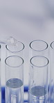 Scientist, dropper and liquid in test tubes in lab for clinical trial, medical research or synthesis. Sample, person and vial in pipette for scientific study, drug development or chemistry innovation