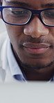 Scientist, glasses and laptop with microscope in lab for clinical trial, disease study or innovation. Eyewear, serious black man or medical tech for cancer research, vaccine development or experiment