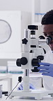 Microscope, black man and scientist in laboratory with research for medical innovation with beaker. Sample, person and chemist with liquid solution for pharmaceutical development with clinic results.