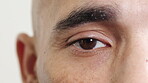 Blinking, eye and vision with man in studio for optometry appointment or checkup. Healthcare, optical and sight with medical patient at ophthalmology assessment for visual correction or improvement