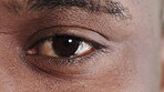 Eye, opening and vision with black man at clinic for optometry assessment or checkup. Healthcare, optical and eyesight with patient at ophthalmology appointment for visual correction or improvement