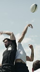 Fitness, jump and men with ball on football field, exercise and active for sport match and wellness. Athlete, training and people on playground for performance, practice and rugby game preparation