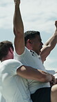 Celebration, fist pump and winner with rugby players outdoor together for achievement or score. Champion, jumping and success with excited people on field for competition, game or match victory