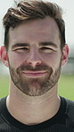 Face, rugby and man on field for fitness, training and match practice for tournament event. Portrait, athlete and male person outdoor with positive attitude, sports game and confident for competition
