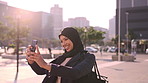 Muslim woman, city and student with selfie, smile and scroll for social media post on morning commute. Islamic person, town and photography for memory, status update and check profile picture