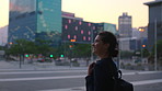 Thinking, college student or woman in city at night for commute, learning inspiration or remember class. Evening, lesson reflection and scholar with smile for education, travel or bokeh in urban town