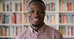 Face, friendly and smile with black man in library as college or university professor for education. Future, happy and learning with teacher in bookstore for academic job, knowledge or research