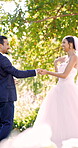 Dancing, bride and groom with smile in park, marriage commitment and wedding tradition for celebration. Laughing, outdoor and happy people with couple union on special day, love and moving together