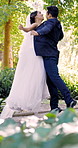 Excited, couple and jump outdoor at wedding, celebration and partnership at ceremony event. Smile, people and chest bump at park with clumsy wife, marriage success and playful gesture for commitment