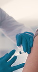 Doctor, medical or hands with vaccine injection for safety, protection booster or treatment. Needle, people or patient with virus immunity, prevention or medicine with flare in healthcare clinic