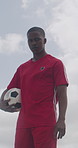 Soccer, sports and face of black man with ball for playing game, training and practice for match. Low angle, athlete and portrait of person with catch for exercise, challenge and fitness outdoor