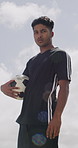 Soccer, confident and face of man with ball for playing game, training and practice for match. Low angle, athlete and portrait of person with catch for exercise, challenge and fitness for sports club