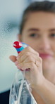 Detergent, window and cleaning with woman in office, hygiene and remove dust for sanitation. Cleaner, chemical and cloth in workplace for glass disinfection, cleanliness and polishing spray for shine