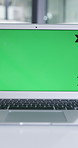 Empty, business and laptop in office with green screen, research and finance report for audit. Ux, mockup space or pc in workplace for accounting, budget review and information on investment proposal
