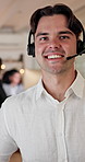 Face, consultant and happy man with headset in call center office for online advice or telesales. Portrait, male person or friendly agent with smile or mic for virtual assistance, help or support