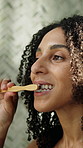 Woman, brushing and teeth in bathroom for hygiene, oral health and morning routine for fresh breath. Person, cleaning and mouth at house with toothbrush, remove plaque and and self care for grooming
