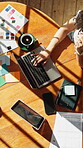 Above, laptop and remote work with woman at table in apartment for interior design or thinking. Computer, sunlight and typing with freelance employee in office for home decorating or planning