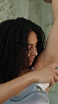 Deodorant, hygiene and woman in bathroom at house for self care, grooming or morning routine. Happy, getting ready and female person with spray for fragrance, aroma or smelling good in apartment.
