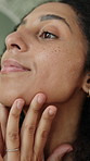 Facial, cream and skincare of woman in home bathroom with serum, dermatology or moisturiser. Happy, lotion and morning routine of person for self care, wellness and grooming for beauty glow or shine