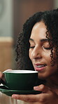 Smile, woman or smell coffee on sofa for comforting memory, peaceful morning or weekend break. Relax, thinking or calm person with beverage aroma in home for nostalgia, bliss or me time satisfaction