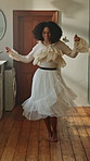 Dance, energy and excited with woman in kitchen of home for break, morning or celebration. Music, smile and stress relief with happy person in apartment for freedom, having fun or joy on weekend