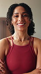Face, woman and arms crossed in home for yoga, fitness and break from holistic training in lounge. Portrait, female person and rest at house with smile, positive attitude and sweat from yogi practice