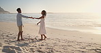 Holding hands, love and black couple by beach on holiday, getaway or weekend trip in summer together. Spin, care and people for vacation with support in marriage, romance or anniversary by ocean.