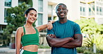 Fitness, interracial couple and smile in city for teamwork, progress and support for wellness. Man, woman and arms crossed in urban town for exercise, portrait and happy for health and development