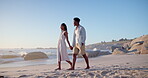 Happy, black couple and walk on vacation at beach for honeymoon trip, connection and bonding. Support, people and holding hands at seaside for romantic stroll, summer holiday and anniversary getaway