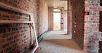 Construction, hallway and brick wall with interior of building for renovation, architecture and concrete. Property development, industrial and empty space or site for real estate and home restoration