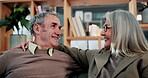 Love, smile and old couple in house with hug, security and romantic moment in retirement. Happy, comfort and elderly people on couch with embrace, commitment or connection in healthy relationship.