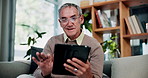 Relax, smile and tablet with old man on sofa in living room of home for ebook reading. App, scrolling and story with happy senior at apartment for break, literature hobby or me time in retirement
