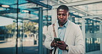 Reading, message and businessman with phone in city, travel or communication with contact on website. Outdoor, employee and black person with mobile for chat, commuting and networking on social media