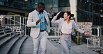 Business people, high five and dancing with smile in city, team and happy for stock market increase. Laughing, wealth manager and celebration with colleague on stairs, rhythm and excited for success