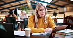 Woman, typing and college student in library with tablet, education and research for assignment task. Person, study and reading textbook in university with tech, learning or browse online for project
