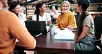 Happy, students and discussion in college with group project, education and laptop for homework task. People, smile and study in university with conversation, assignment and learning for development.