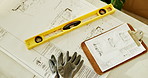 Empty, architecture and blueprint on table with clipboard, construction or building design. Floor plan, paperwork and empty with ppe, equipment and tools for infrastructure development and paperwork