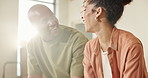 Funny, talking and black couple in home, smile and bonding together for commitment. Humor, man and woman in lounge, laughing and romance with love, communication and relationship with happiness