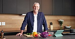 Face, home and old man with vegetables, cooking and confidence with tablet, recipe and smile. Happy, pensioner and senior person in kitchen, skills and ingredients with meal prep, health and food