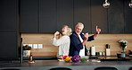 Cooking, fun or old couple in home with dance, happy moment or bonding in meal prep. Romantic, groove or senior people in kitchen with movement, culinary activity or playful connection in retirement.