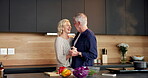 Cooking, love or old couple in kitchen with dancing, playful moment or bonding in meal prep. Happy, groove or senior people in house with fun, culinary activity or romantic connection in retirement.