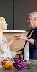 Cooking, dance and holding hands with old couple in kitchen together for bonding or meal prep. Food, love and turn with excited senior people in apartment for fun, healthy eating or laughing