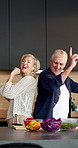 Cooking, dance and energy with old couple in kitchen of home together for bonding or meal prep. Food, music and rhythm with senior people having fun in apartment for healthy eating or laughing